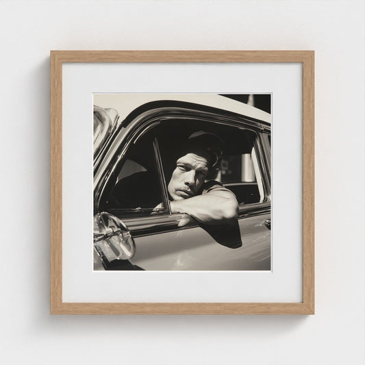 Contemplative Man at Vintage Car Window in Monochrome