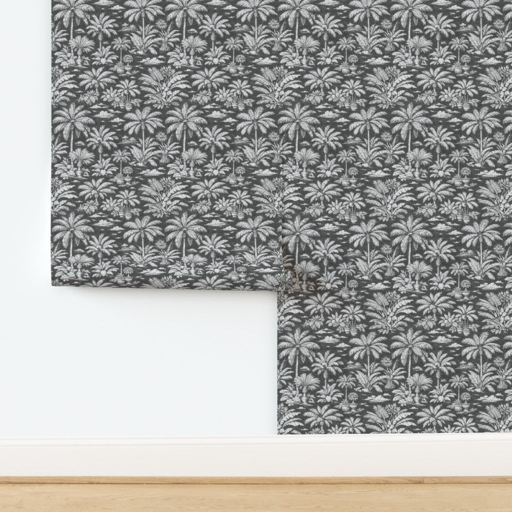 Roll of Palmy Weather wallpaper in refined Charcoal colorway.