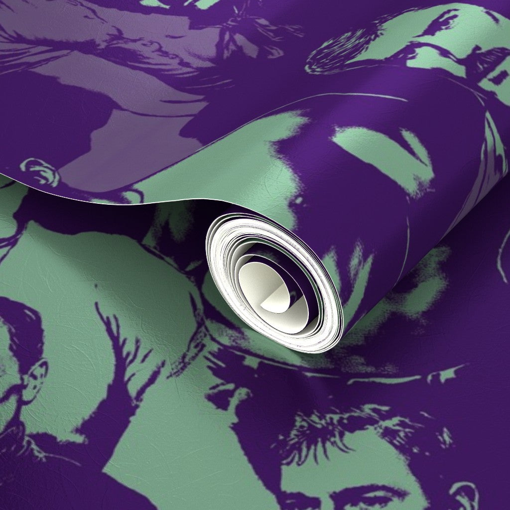 Purple and green graphic wallpaper rolls aligned closely to show pattern transition