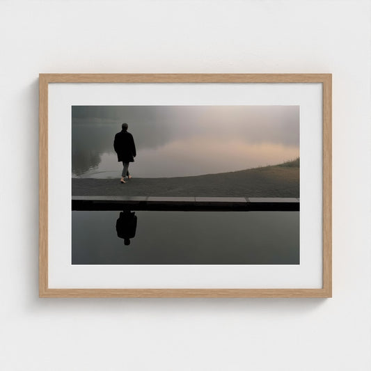 Solitary Figure on Fogged Lakeshore in Taupe Greys