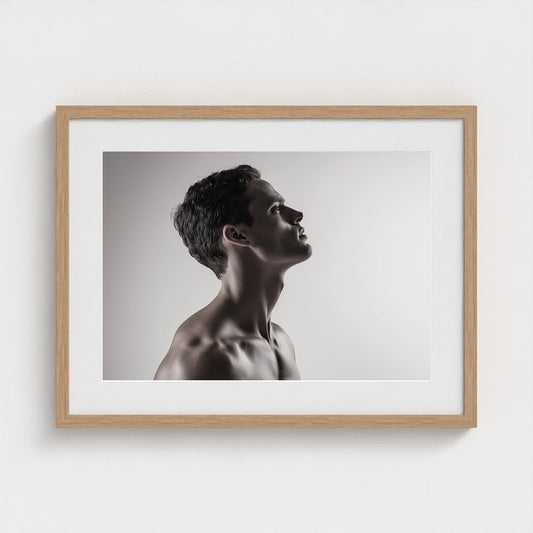 Contemplative Male Profile in Soft Grayscale Light