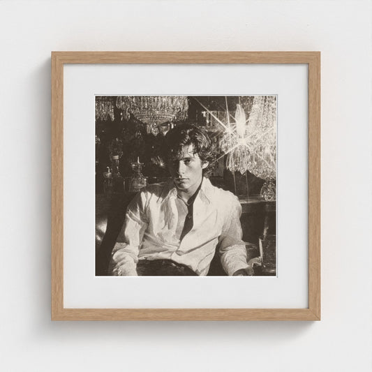 Contemplative Bar Portrait with Crystal Chandeliers