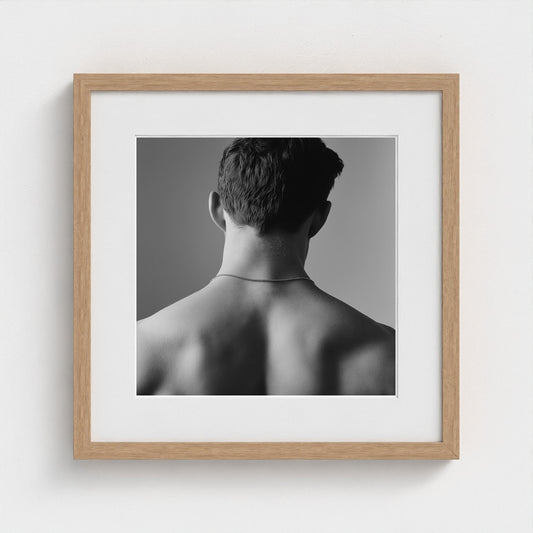 Contemplative Male Back Portrait in Monochrome Light
