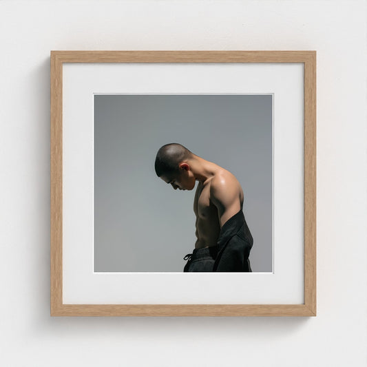 Contemplative Male Torso Portrait in Soft Gray Tones