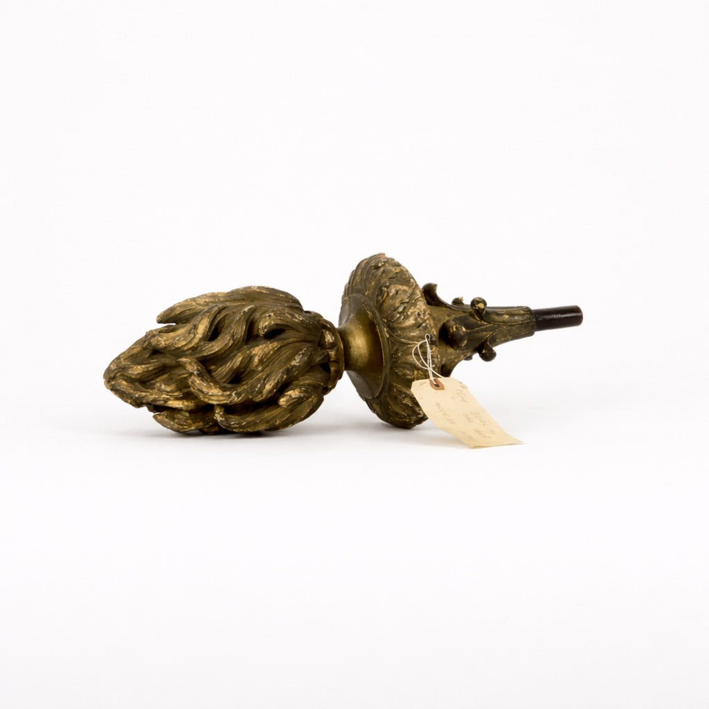 Decorative brass door knocker on a white background