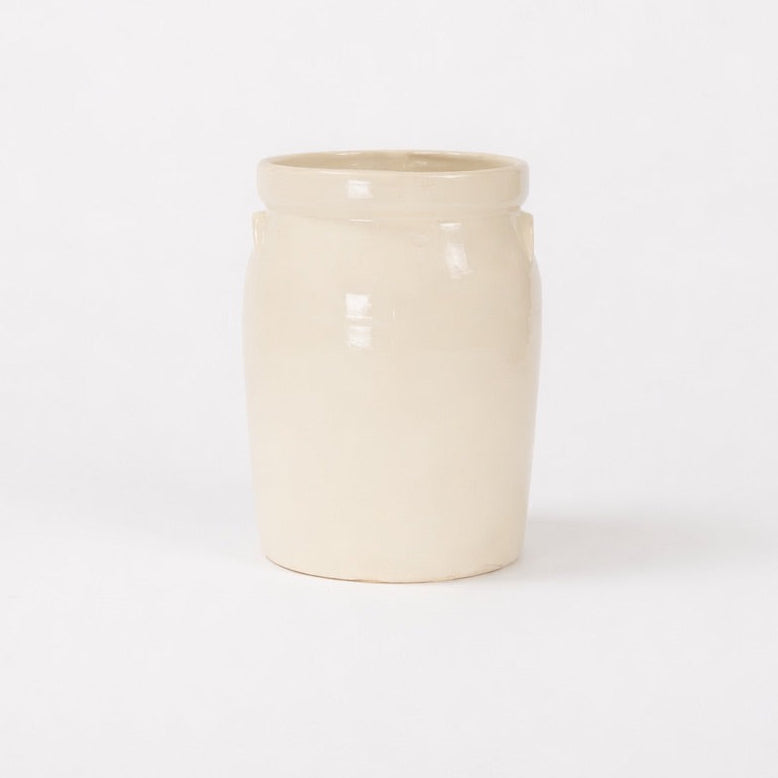 Beige ceramic jar on a white background