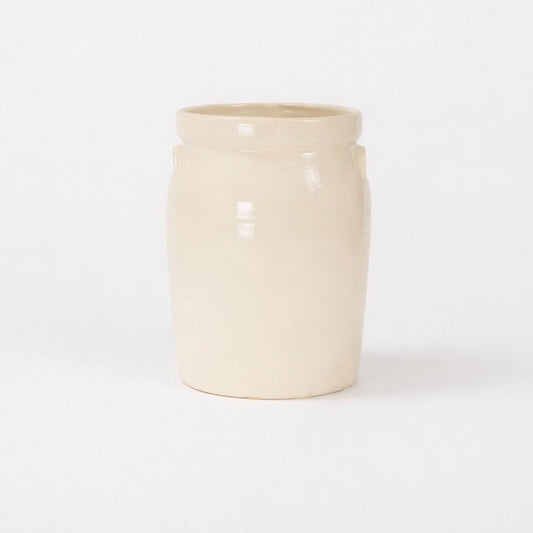 Beige ceramic jar on a white background