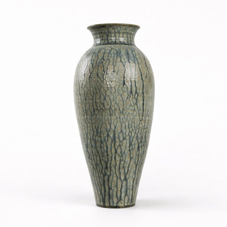 Decorative vase with textured surface on a white background