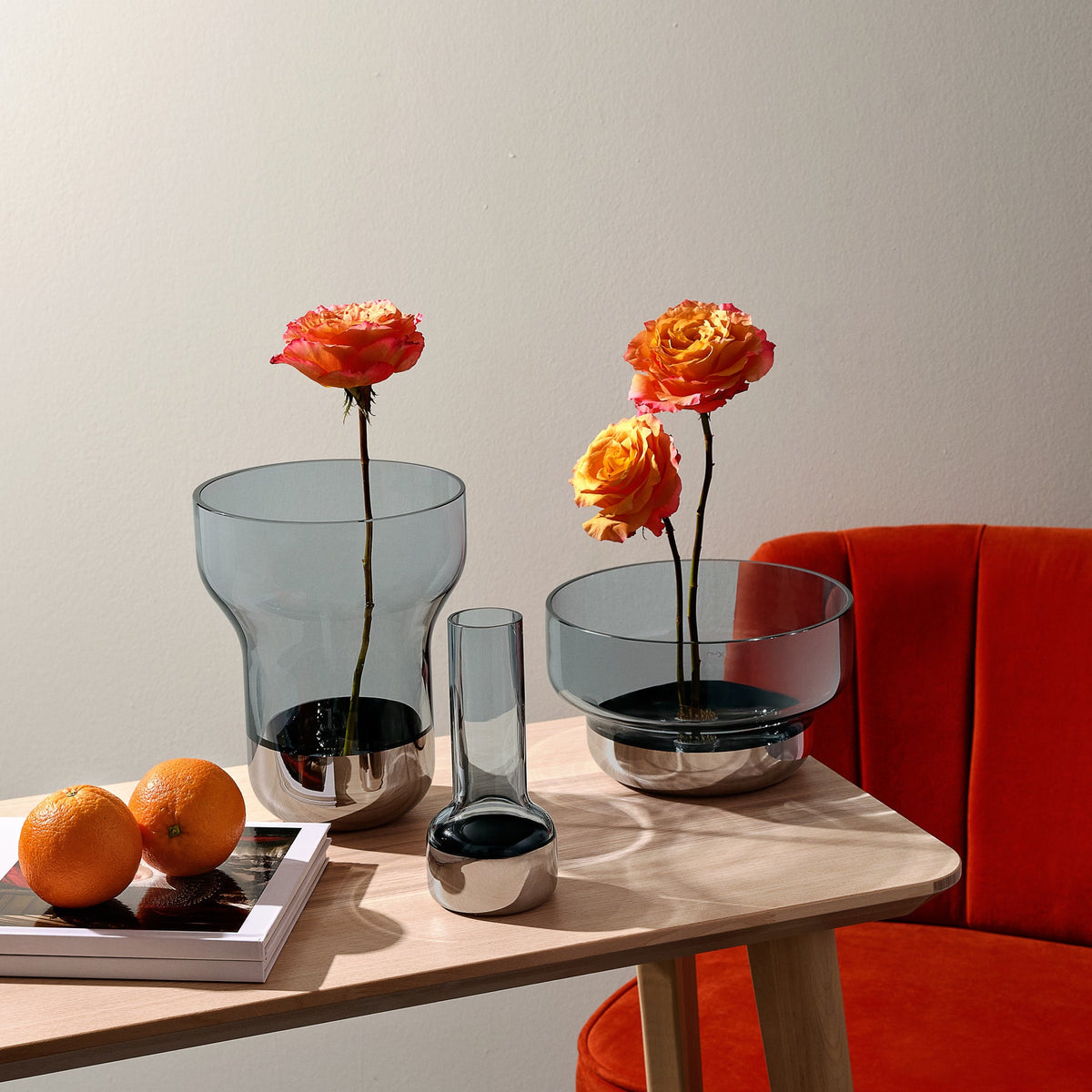 Stylized arrangement of NUDE Glass Contour collection vases showing different shapes