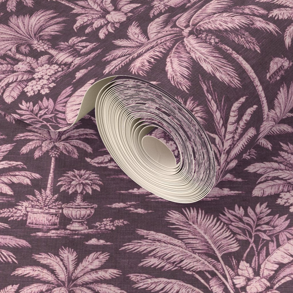 Close-up of exotic garden scene on Pink Palmy Weather grass cloth wallpaper.