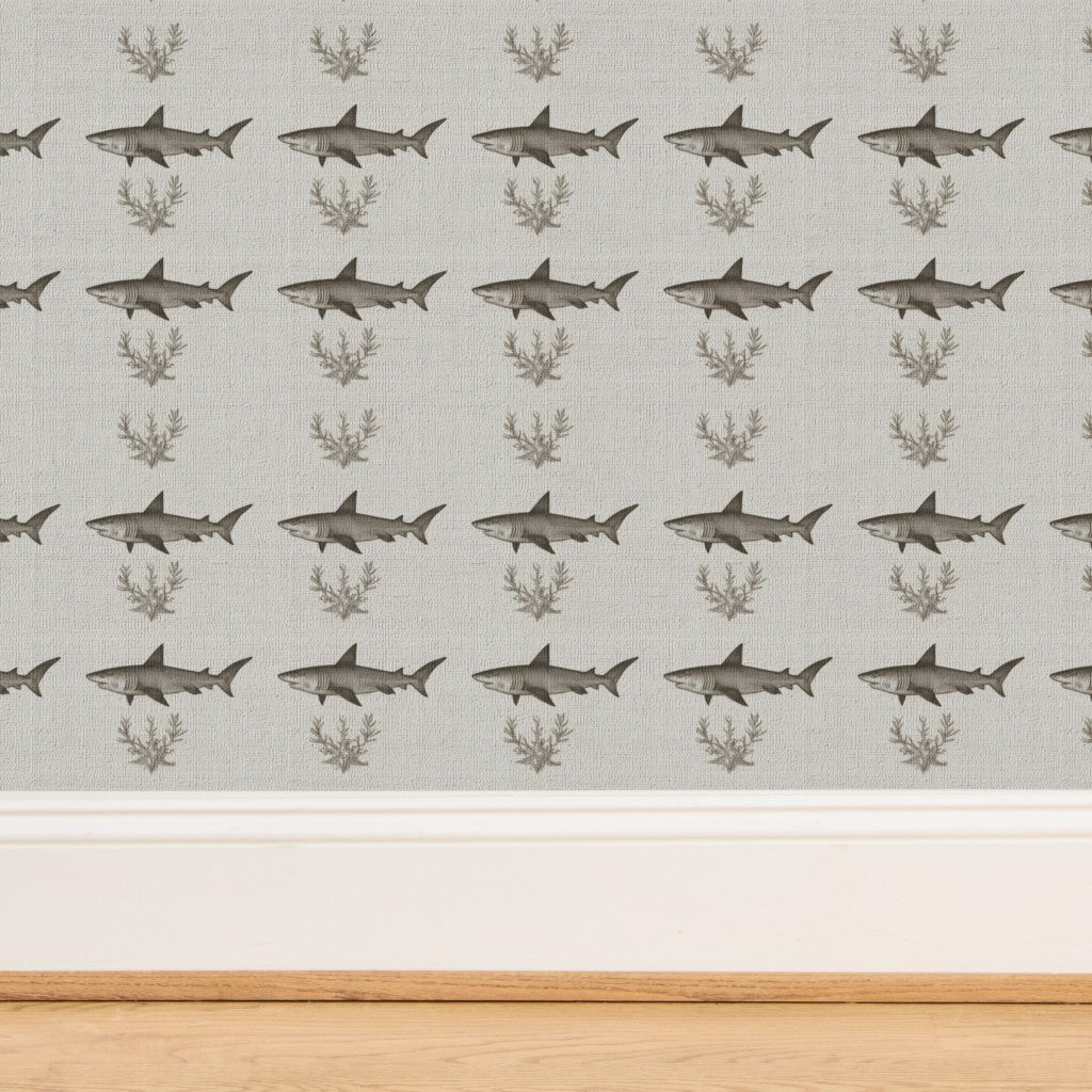 Close-up perspective of the woven natural fibers on the grasscloth Solo Swimmer wallpaper.