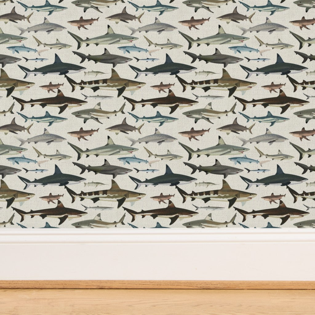 Textured organic grasscloth backing on the Sea of Sharks blue wallpaper.