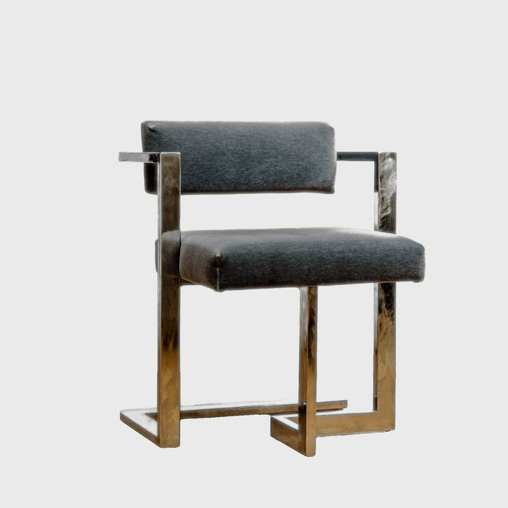 Chair with gray cushioned seat and backrest on a white background