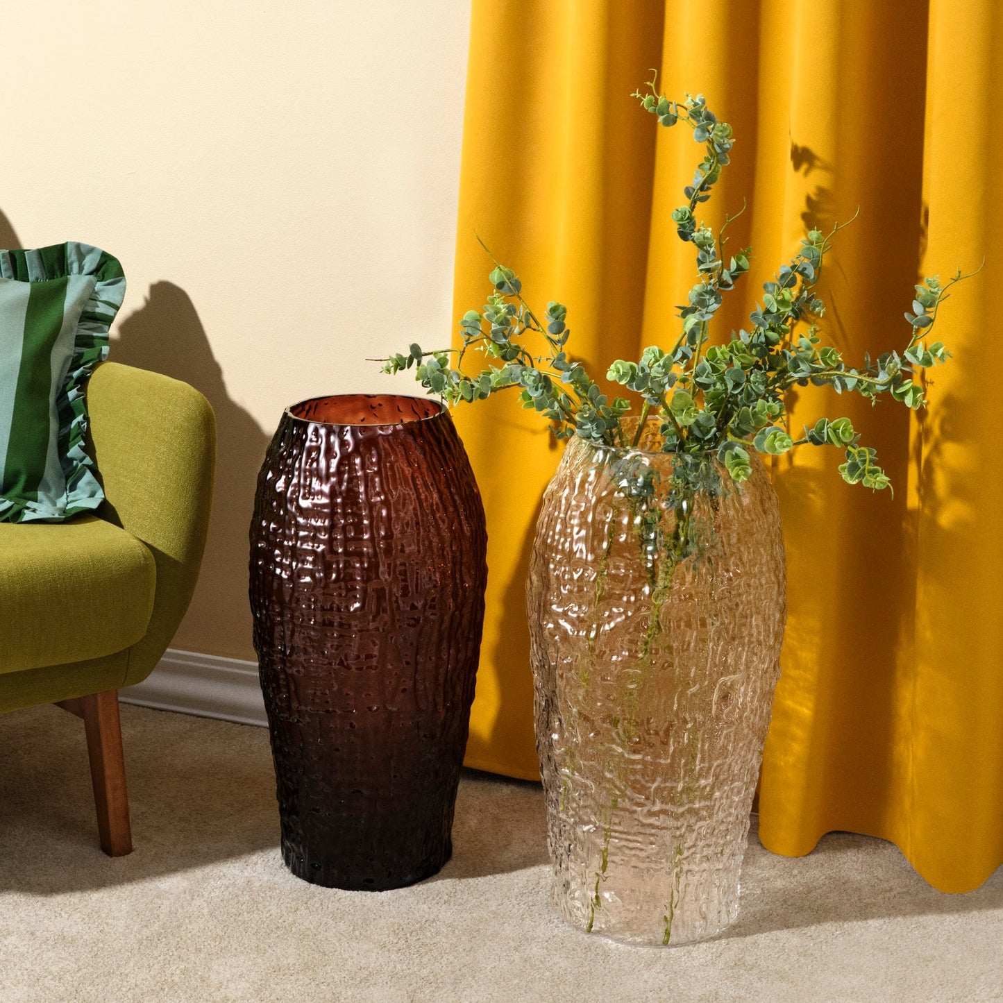 Clear and caramel amber editions of the large NUDE Glass Molten crystal vase styled together.