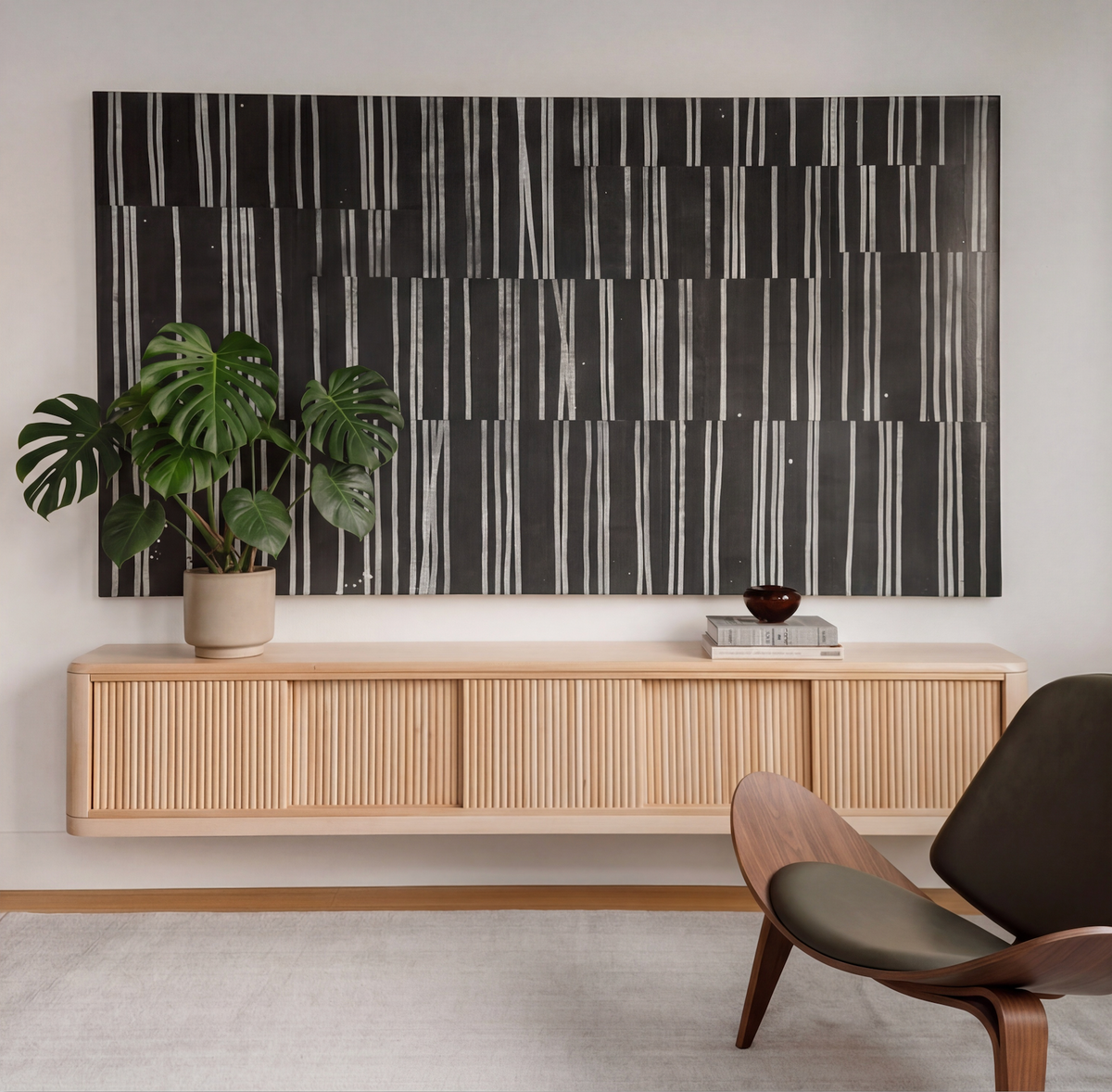 Close-up detail of the rhythmic shadow lines of a wood tambour front console.