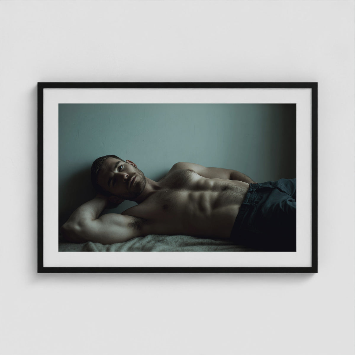 Young Man Lounging 36x24 Black Landscape Box Frame