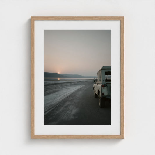 Vintage Land Rover at Serene Coastal Sunset View