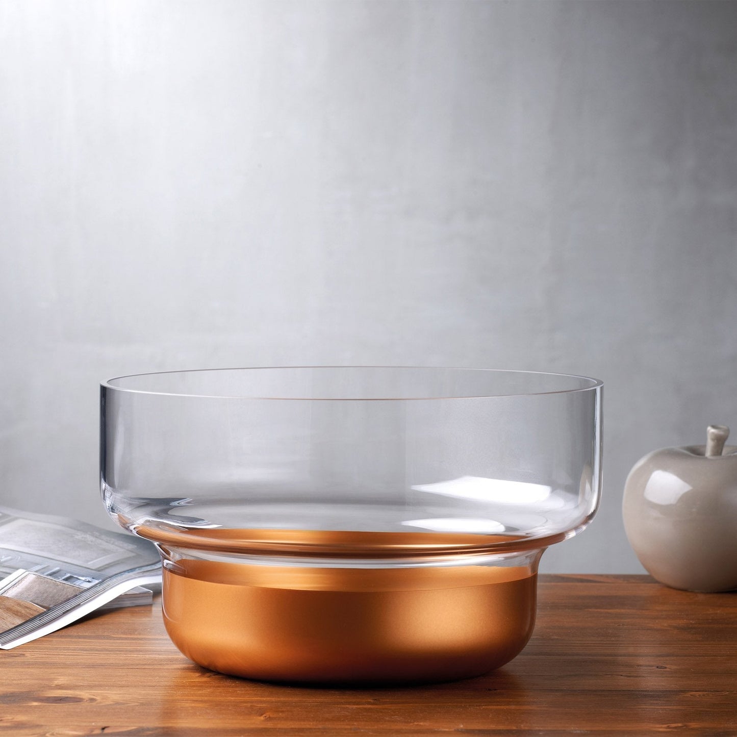 Contemporary NUDE Glass copper contour bowl styled on a polished surface as a chic home decor centerpiece.