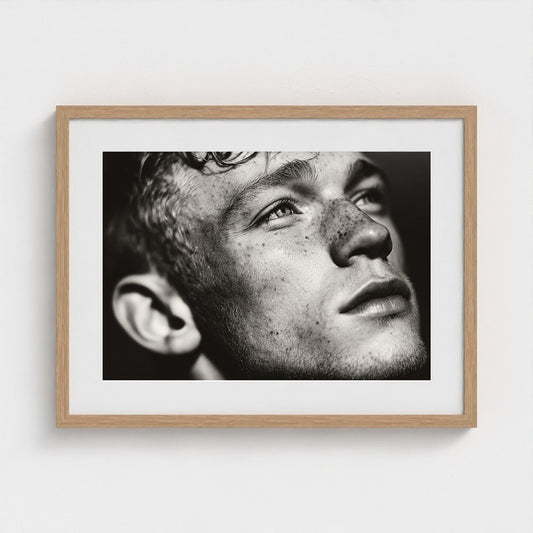 Contemplative Freckled Portrait in Soft Monochrome