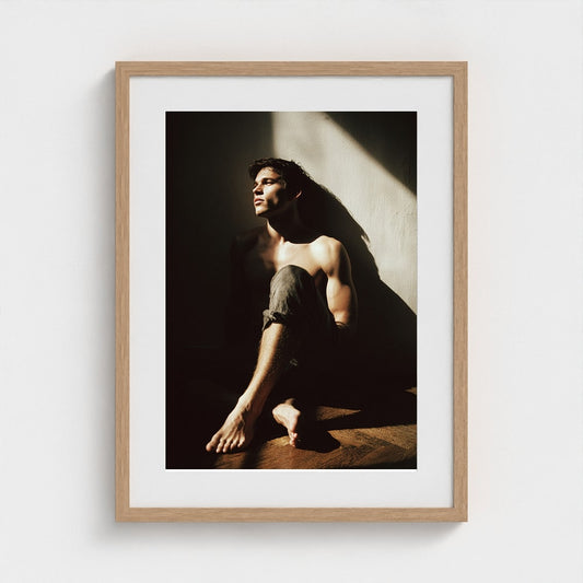 Contemplative Male Portrait in Sunlit Denim Study