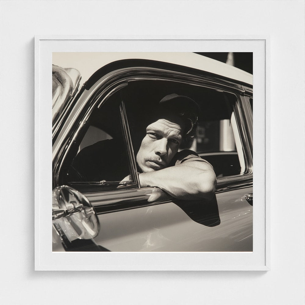 Contemplative Man at Vintage Car Window in Monochrome