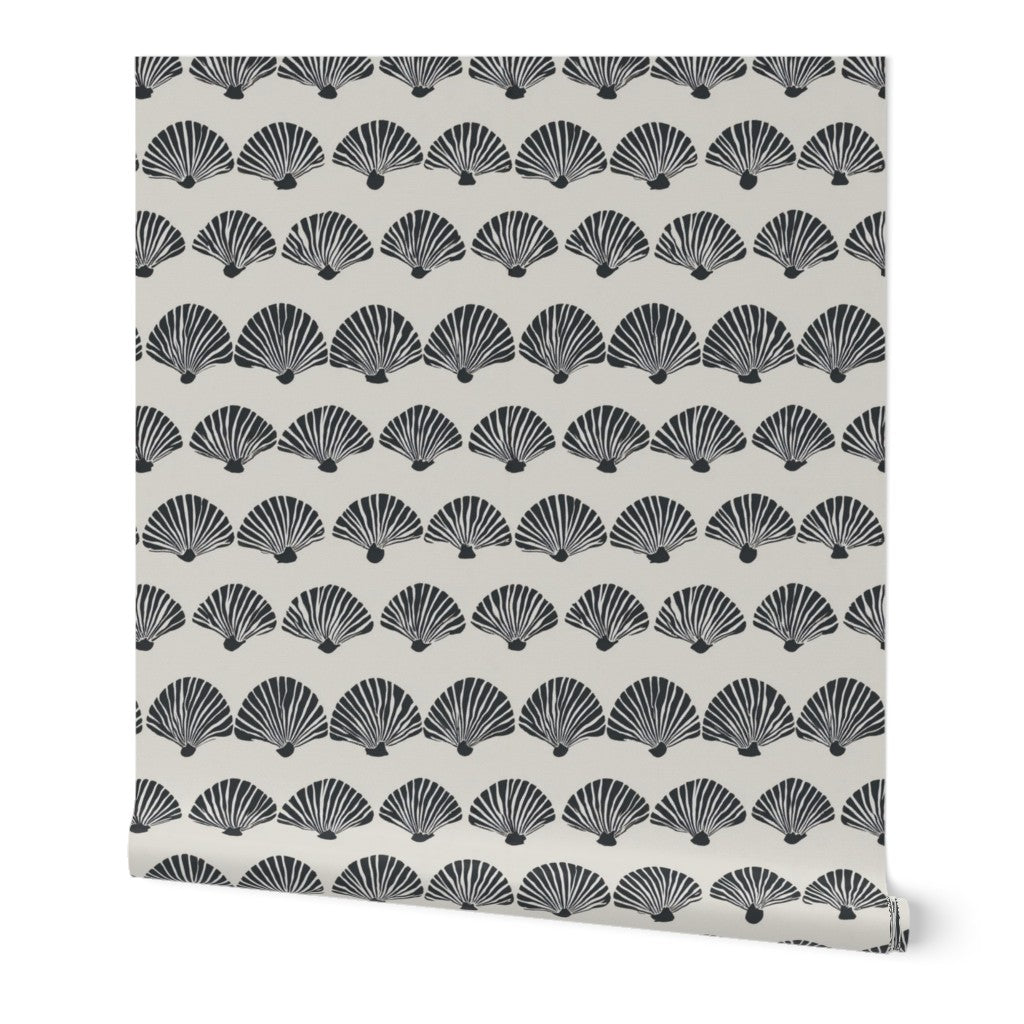 A rolled bolt of The Modern Scallop wallpaper in a sophisticated beige colorway.