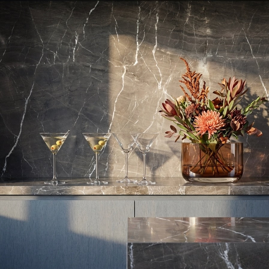 The NUDE Blade Wide Crystal Vase in green, showing its sharp geometric lines and smooth curves designed by Pentagon Design.