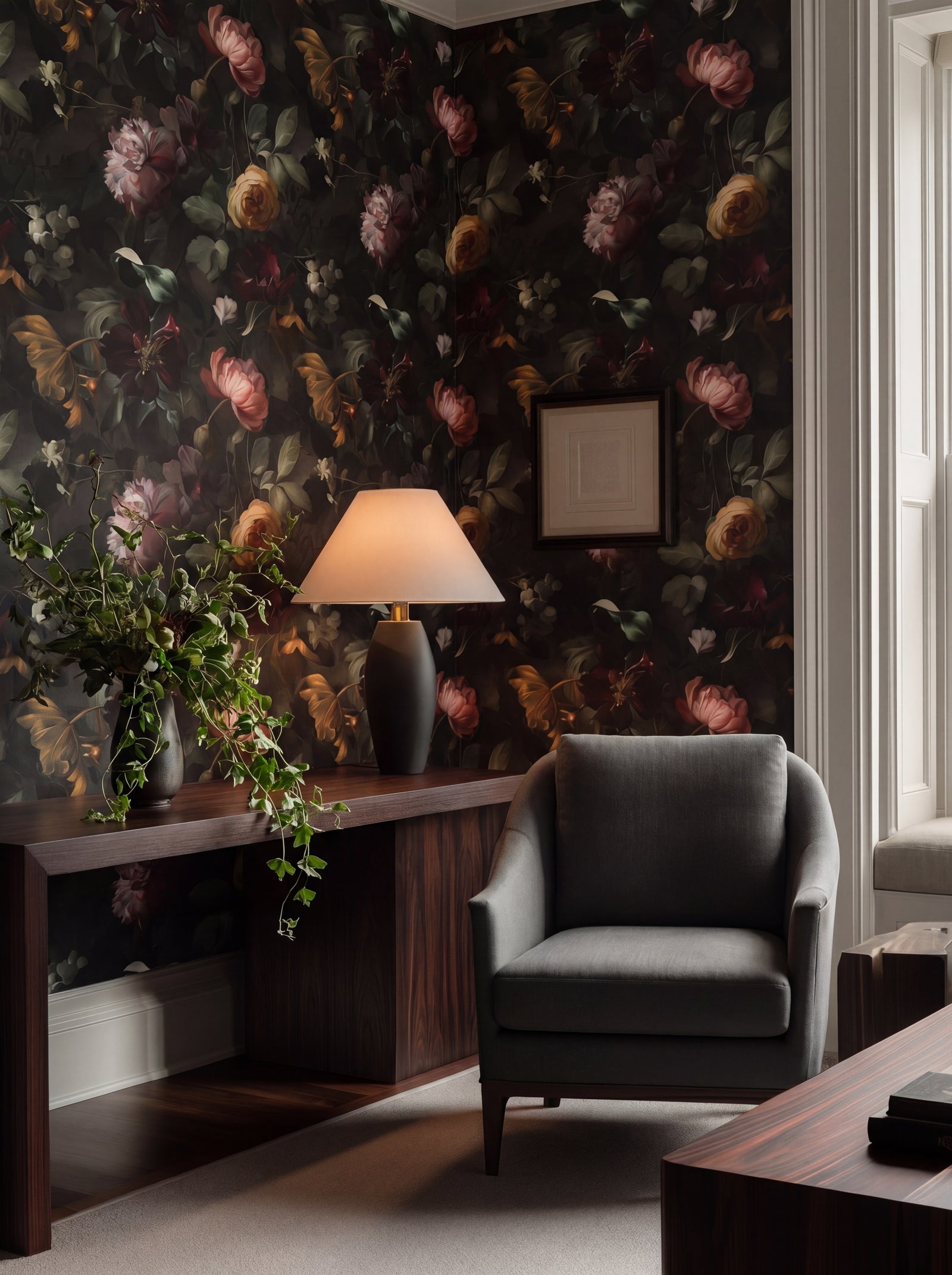 A beautifully decorated room featuring Nocturne Botanical Wallpaper on a dining room wall with elegant furnishings.
