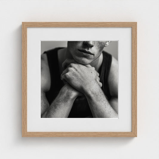 Contemplative Portrait of Youth in Monochrome Light