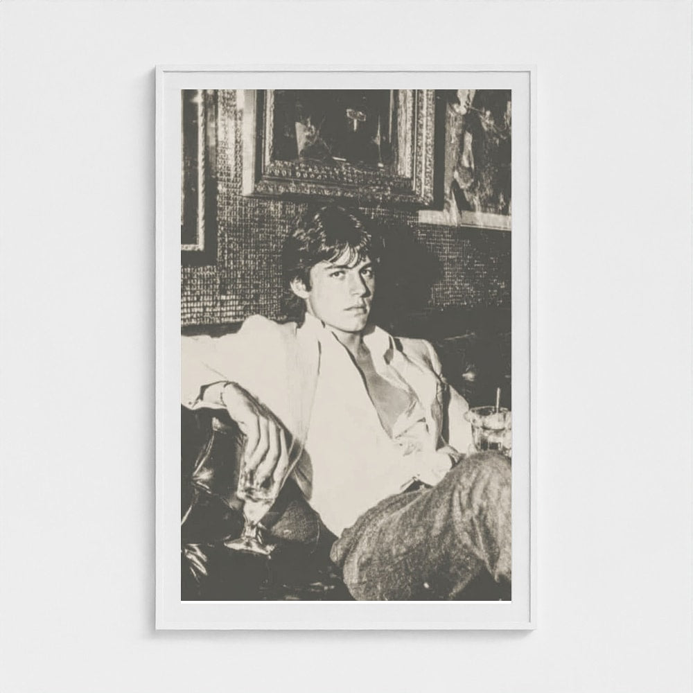 Contemplative Portrait on Leather Sofa in Monochrome