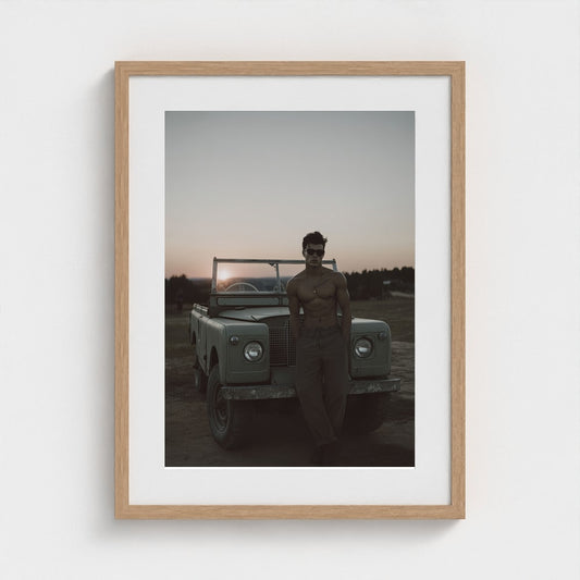 Sunset Portrait Beside an Aged Vehicle in Warm Tones
