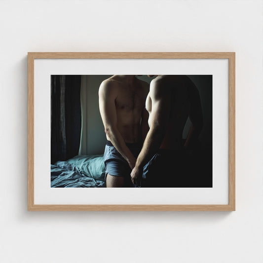 Intimate Male Torso Portrait in Soft Bedroom Light