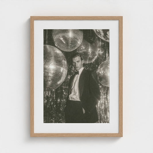 Contemplative Suit Portrait with Silver Disco Orbs