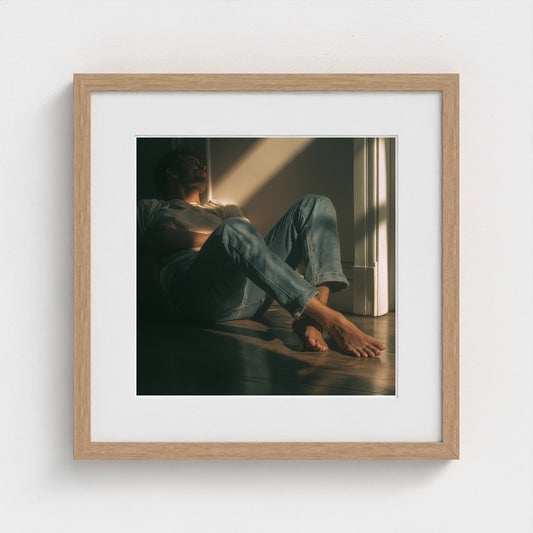 Contemplative Man in Sunlit Floor Portrait Study