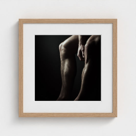 Contemplative Male Torso Portrait in Dark Grey Tones