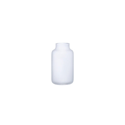 NUDE Glass Mini Magnolia Bud Vase in opal white, showcasing a delicate curved design.