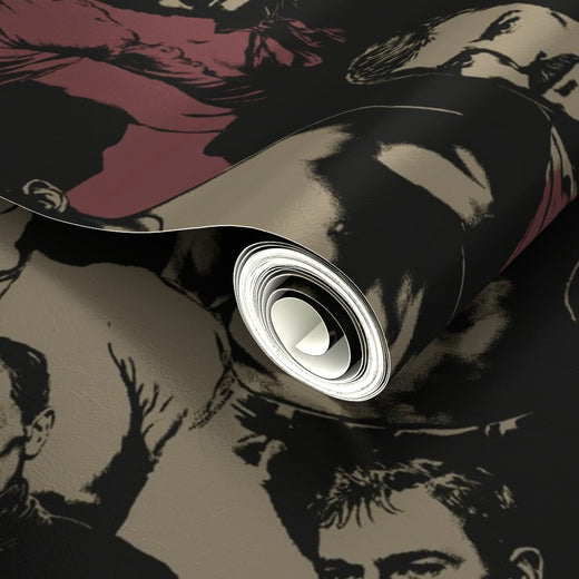 Close-up of crimson and stone patterned wallpaper rolls ready for installation