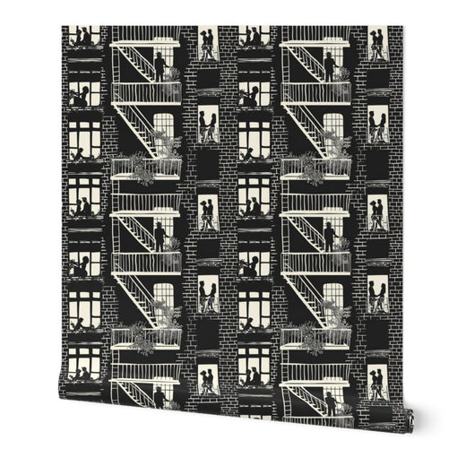 Tex in the City wallpaper roll in black and ivory displayed on a wall