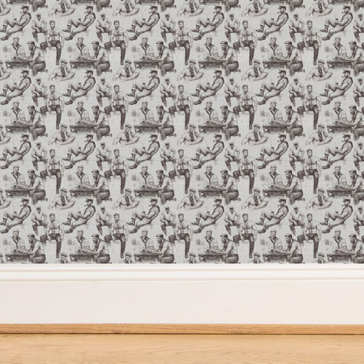 Detailed view of stylized sailor character on artisan wall covering.