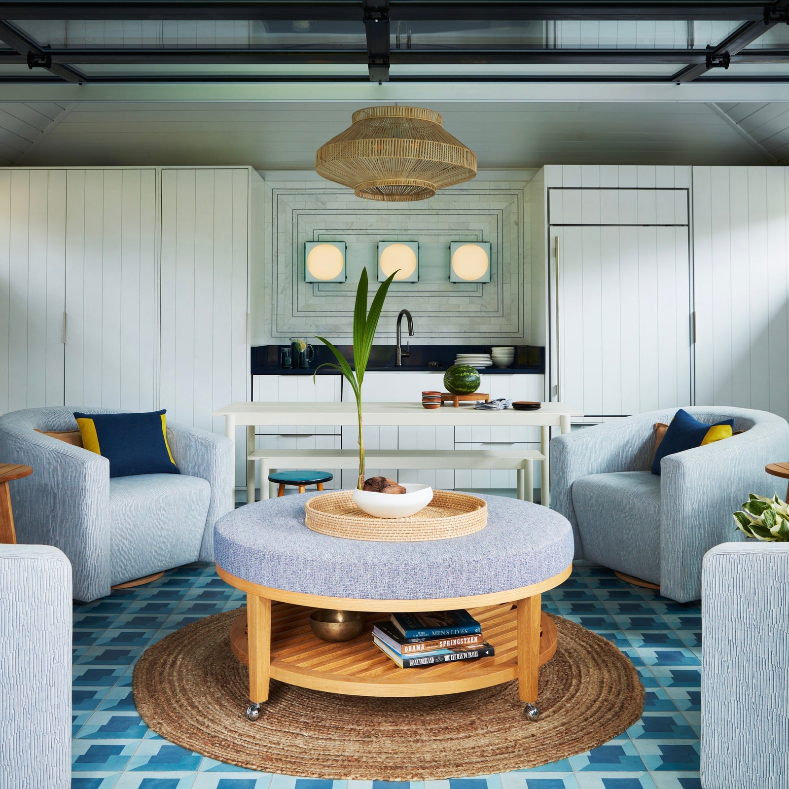 Architectural modern swivel lounge chair in a curated, sunlit residential living room.