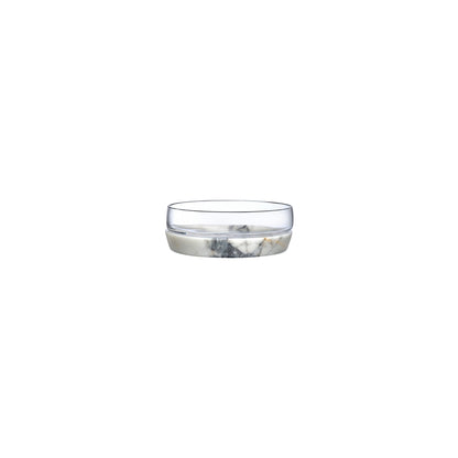 Medium modernist glass bowl resting on a solid round marble base against a clean white background.