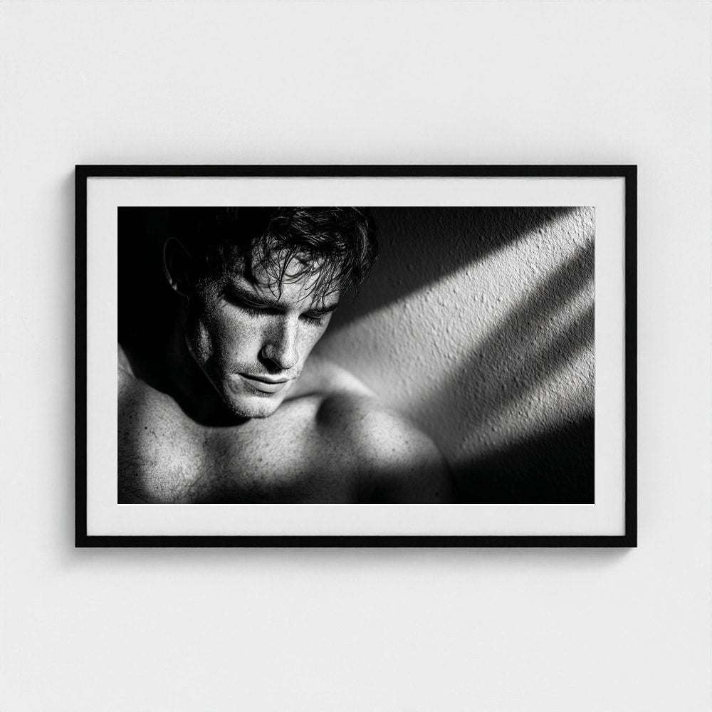 Contemplative Masculine Portrait in Grayscale Light