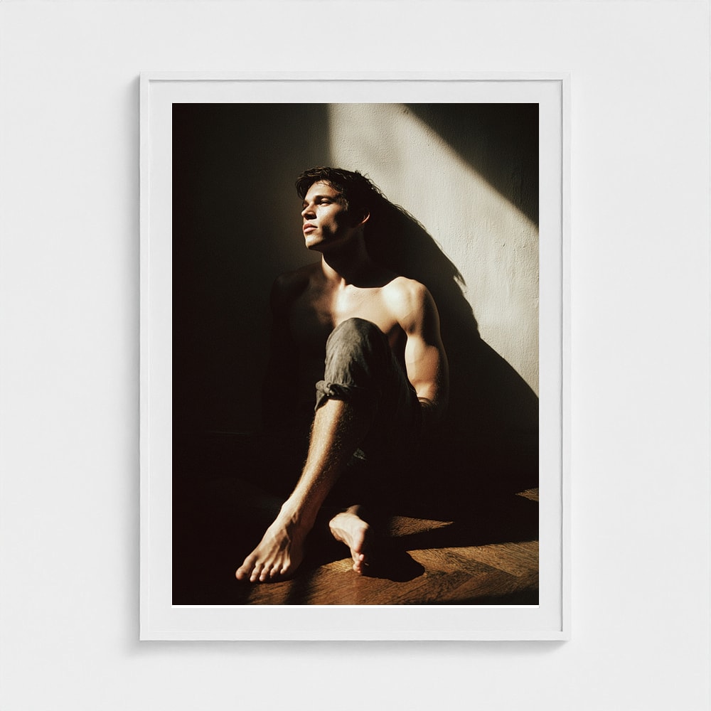 Contemplative Male Portrait in Sunlit Denim Study