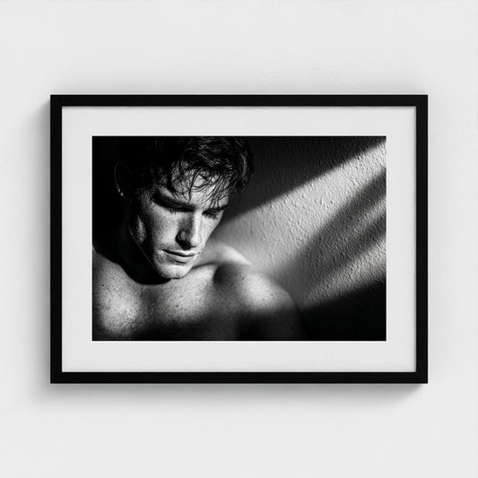 Contemplative Masculine Portrait in Grayscale Light