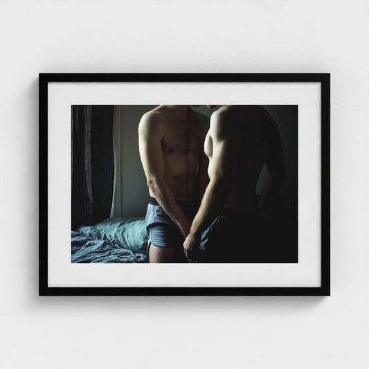 Intimate Male Torso Portrait in Soft Bedroom Light