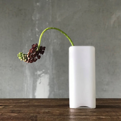 Tall crystal vase arranged with delicate Fritillaria Magic Bells flowers.