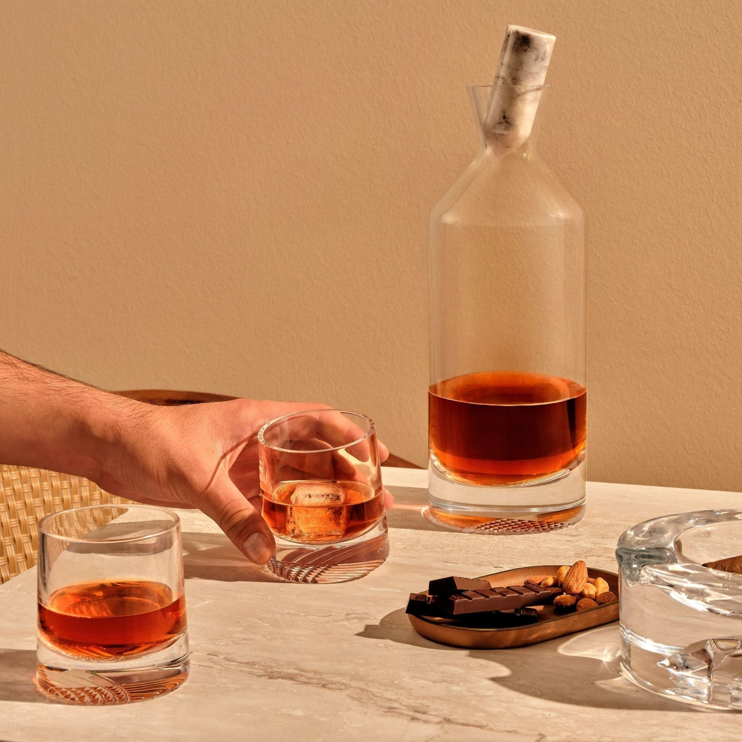 Sophisticated bar setup featuring the Alba tall crystal decanter, lowball glasses, and coordinating accessories.
