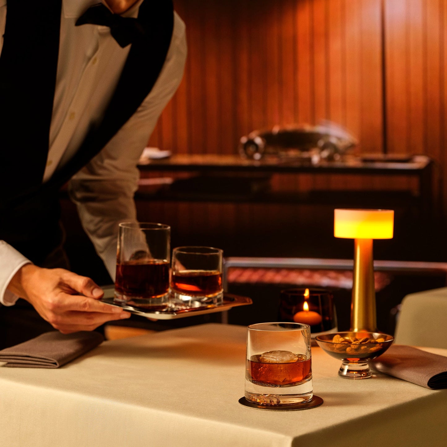 An elegant arrangement of NUDE Alba whisky glasses and a crystal silhouette footed bowl.