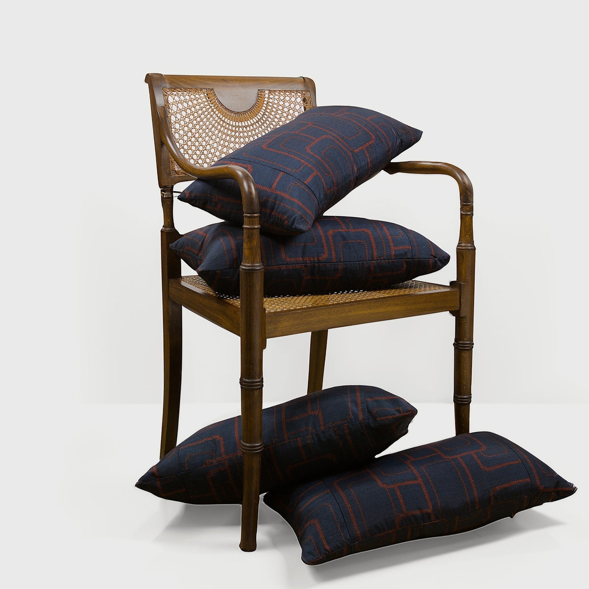 Lifestyle view of Midcentury Cane and Carved Wood Armchai – Masculine Fine Art - Luxury Armchair | Provenance & Patina