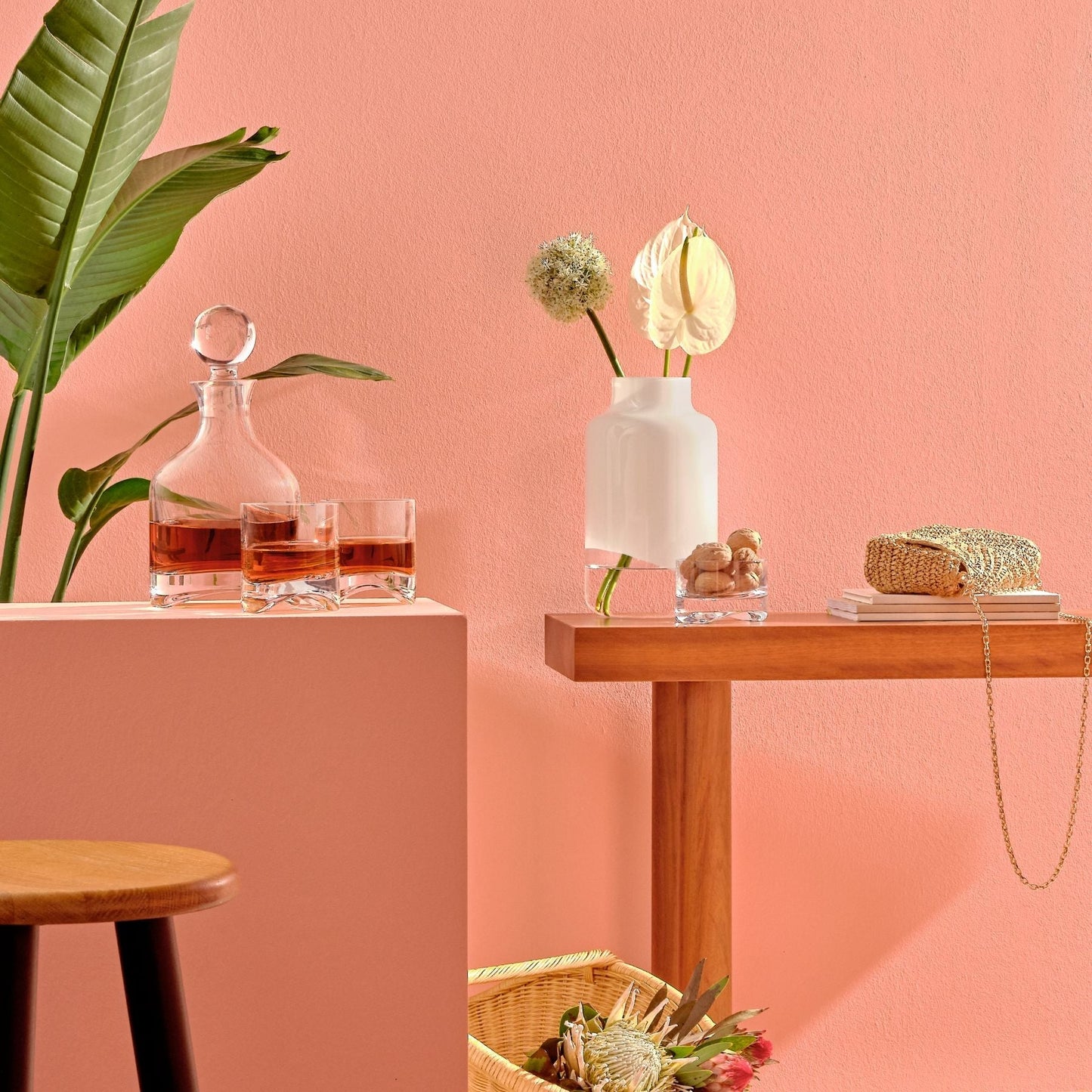 Modern barware ensemble including an Arch whisky bottle, matching glasses, and the medium Magnolia vase.